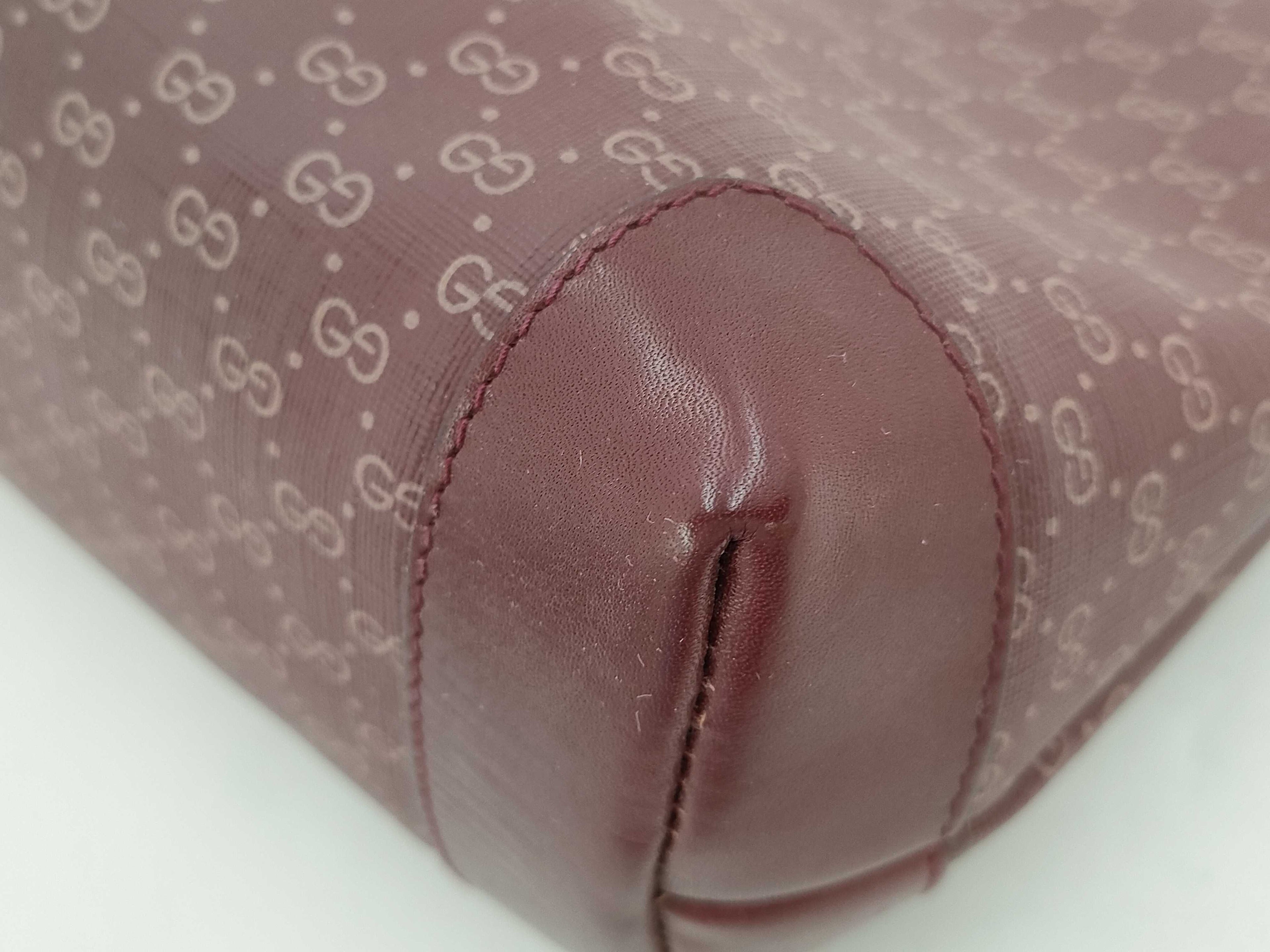Gucci GG Supreme Monogram Clutch