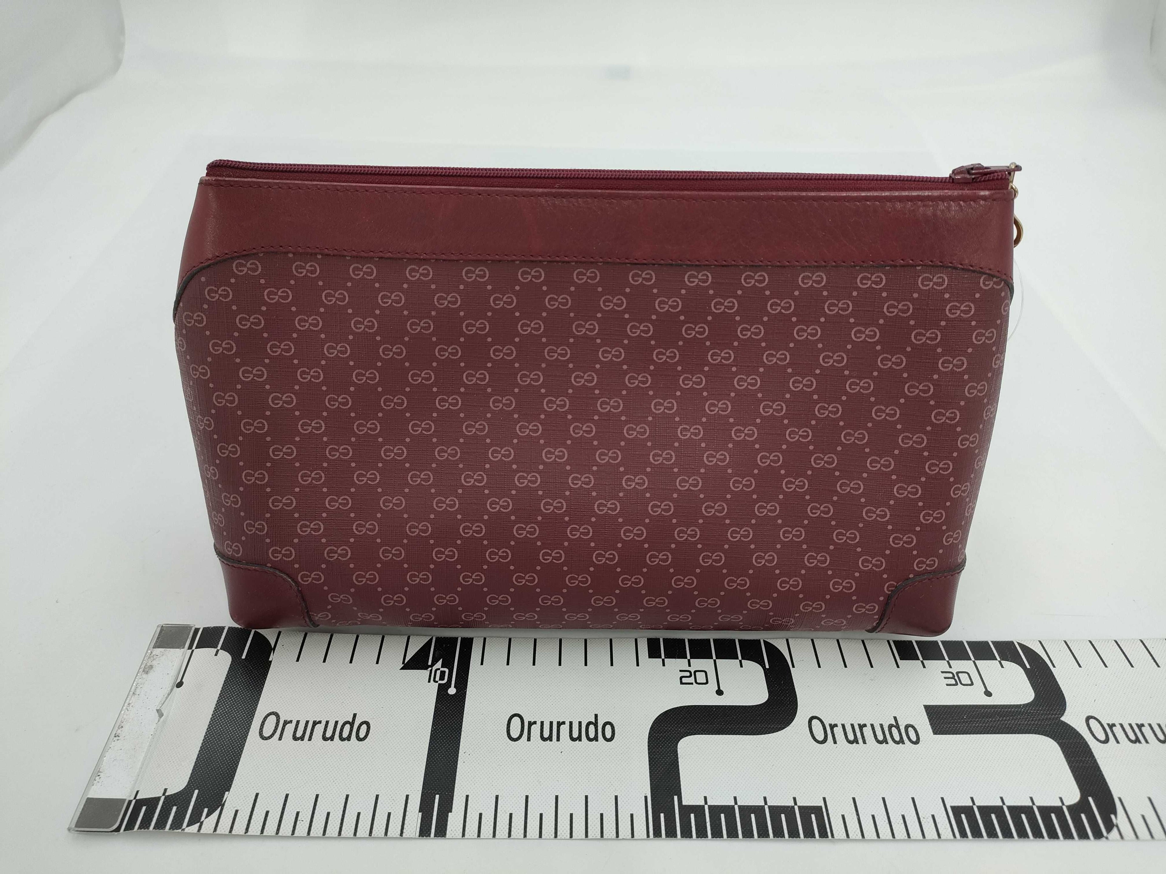 Gucci GG Supreme Monogram Clutch