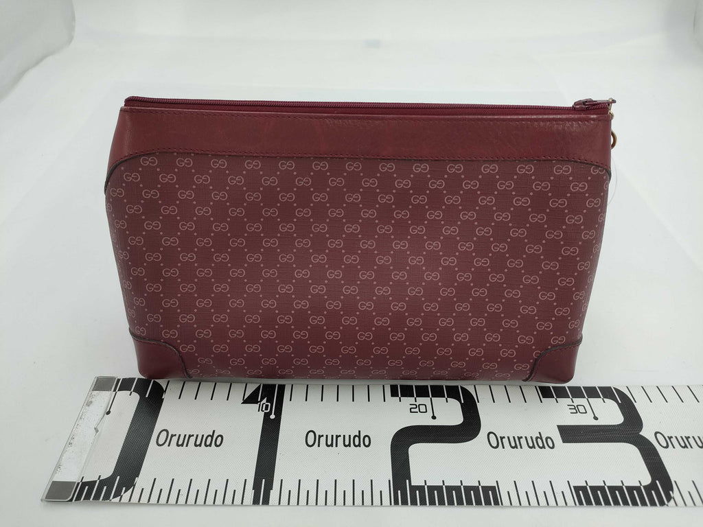 Gucci GG Supreme Monogram Clutch